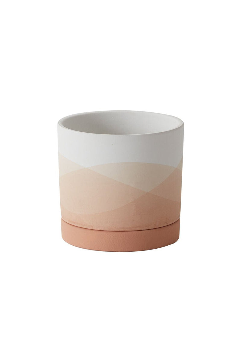 A small Vesper pot shown from the side with undulating shades of pink and white.