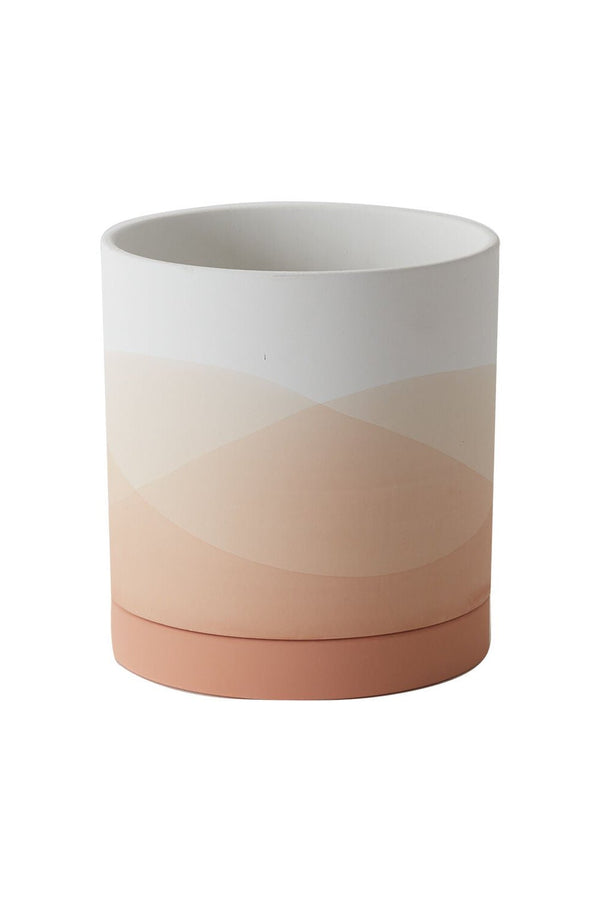 An empty Vesper pot shown from the side with its various shades of pink, peach and white. 