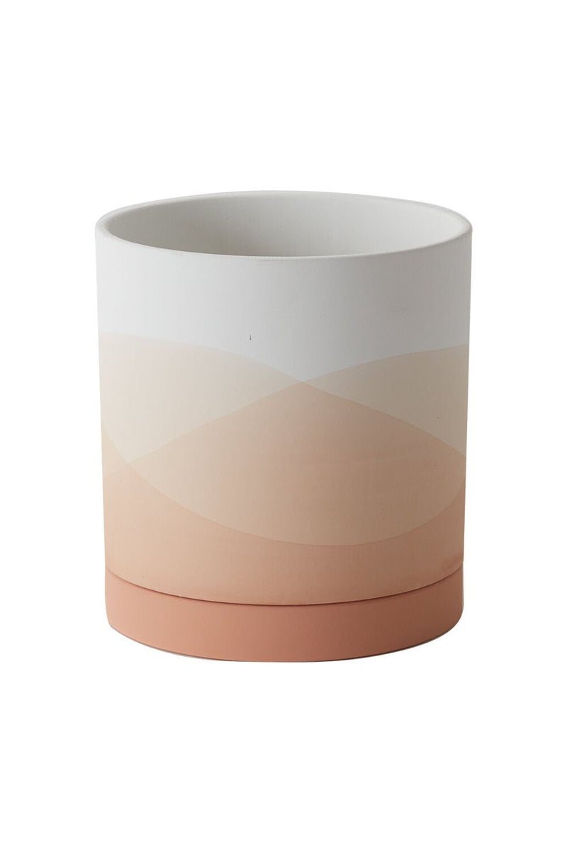 An empty Vesper pot shown from the side with its various shades of pink, peach and white. 