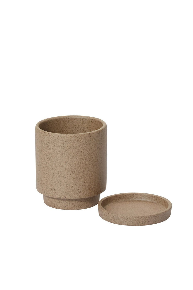 The tan small Imogen planter shown in two parts - it main planter and its saucer.