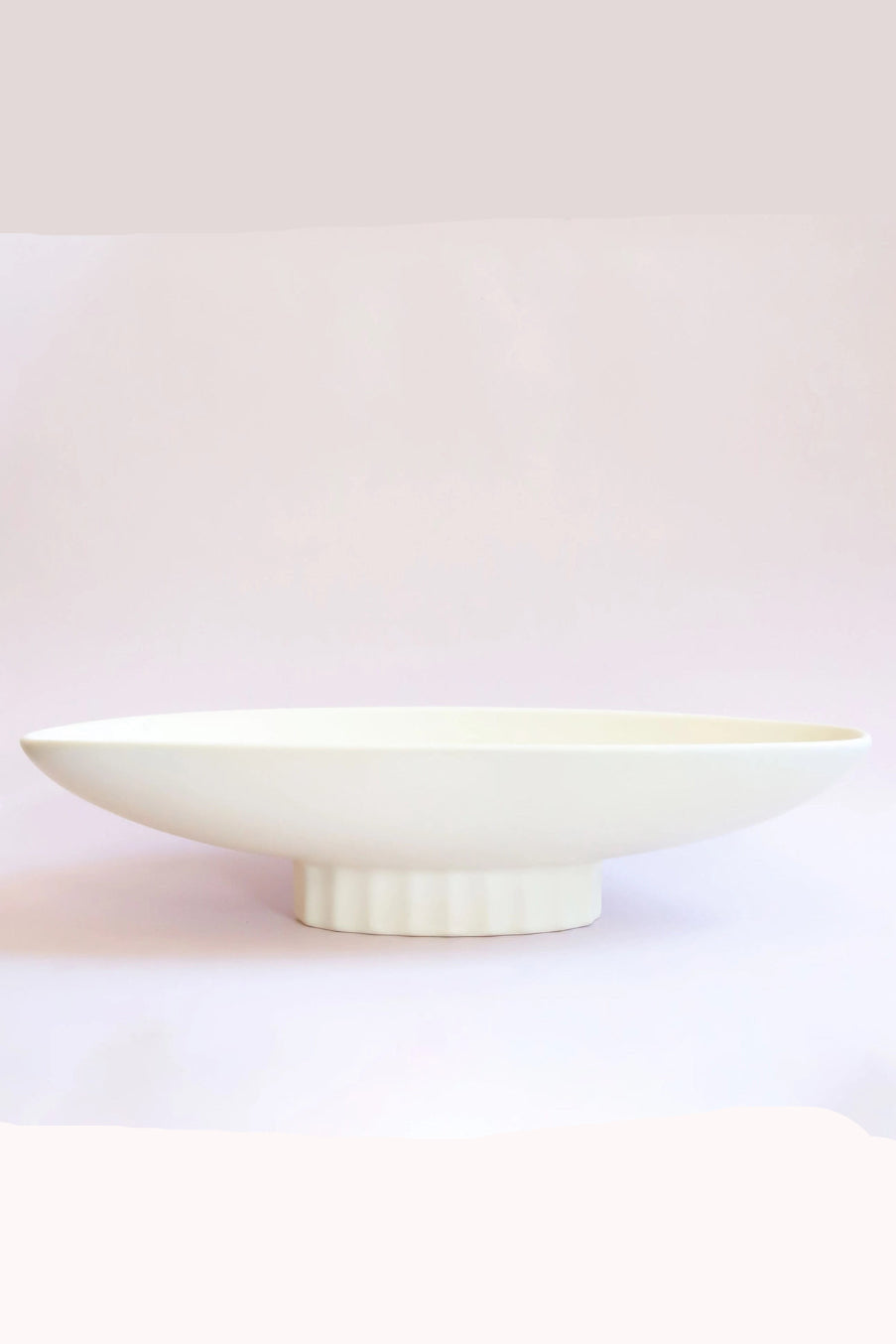 White ceramic Luna bowl on a light pink background ©Jungle Club