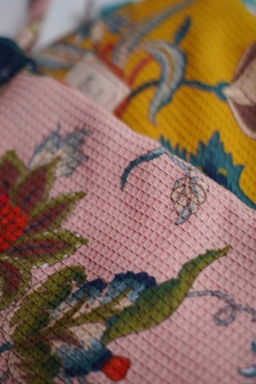 Close-up of a Waffle Cotton Beach Towel w/ Pouch Pink Fleur and Yellow Fleur ©Annahmol