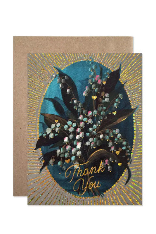 Greeting card with floral design and 'Thank You' text on a brown envelope. ©Hartland Cards