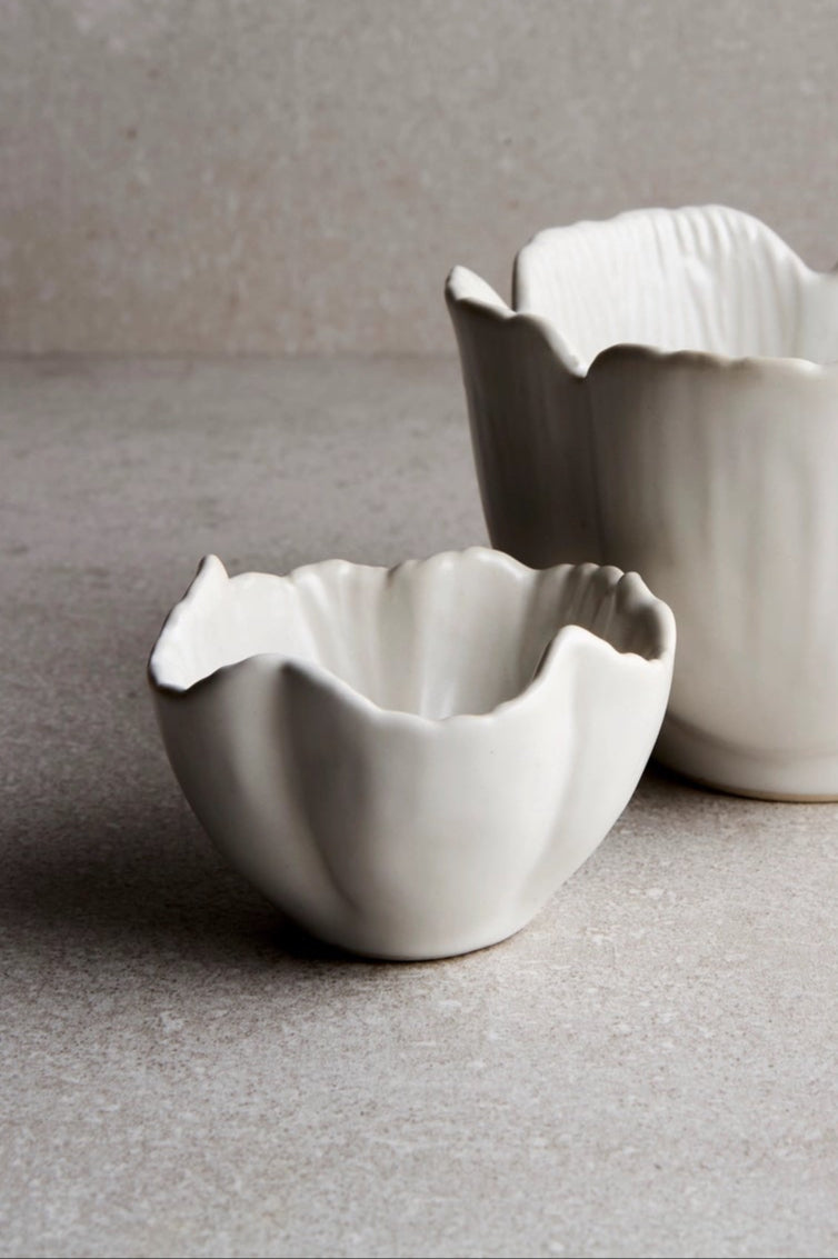 Small Petal bowl in front of a large petal bowl with a gray background and floor ©Goodies