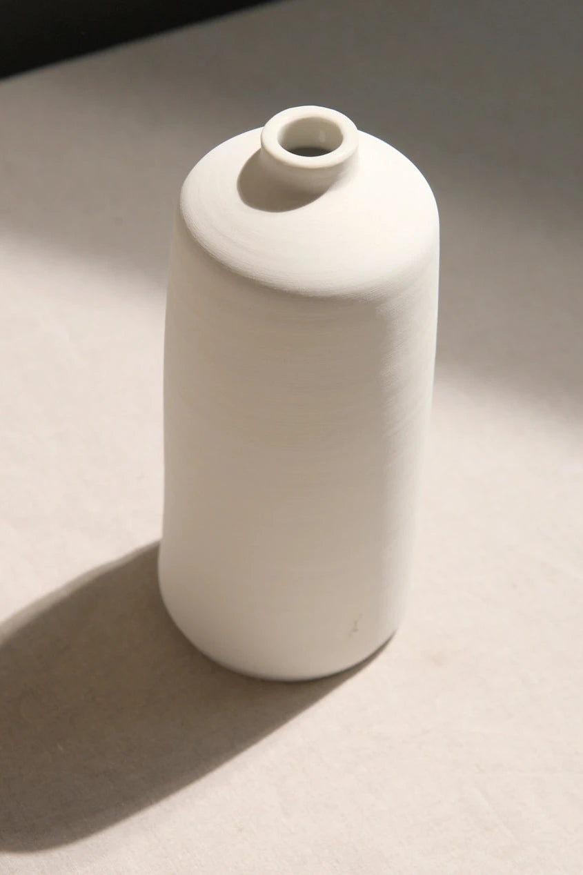 The small Ivory Bud vase by L'Impatience shown from the top side.