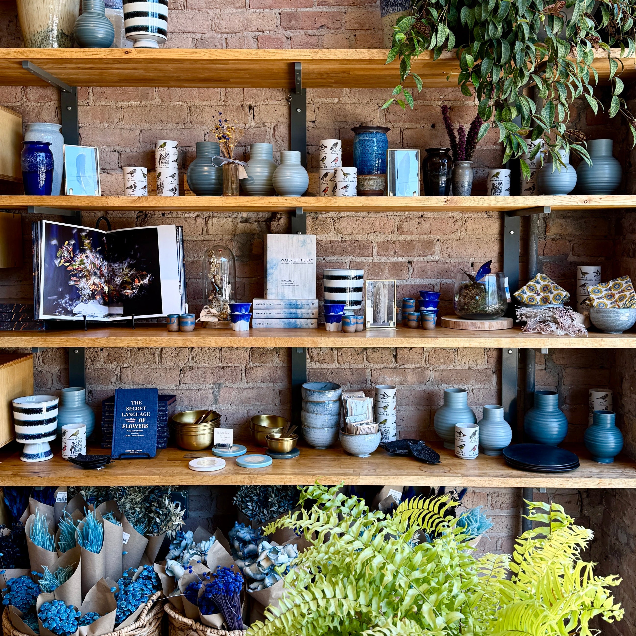 A blue accessories wall at Sprout Home Floral. ©Sprout Home