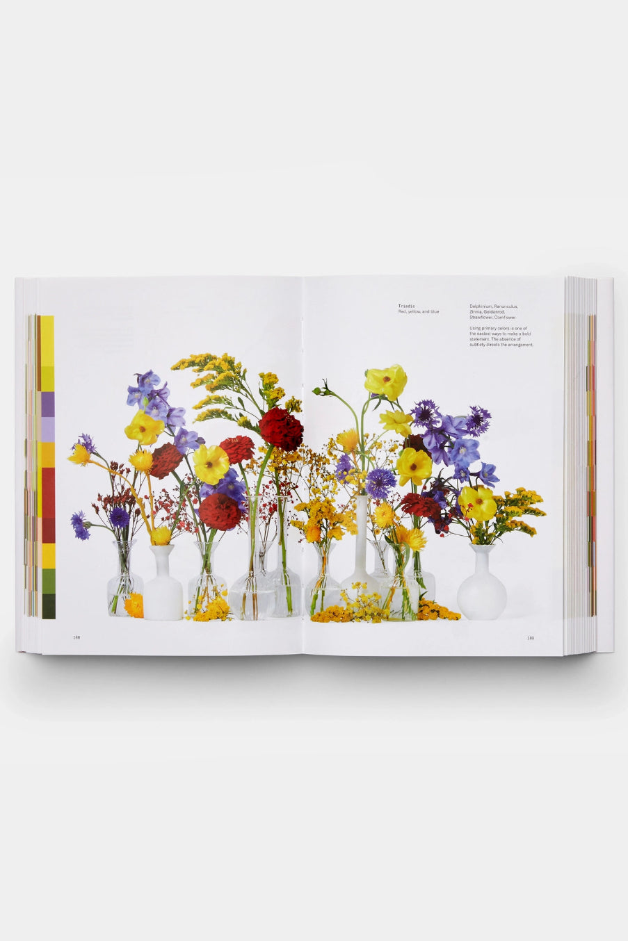 Open Flower Color Theory  book showing colorful floral arrangements in vases on a white background ©Phaidon
