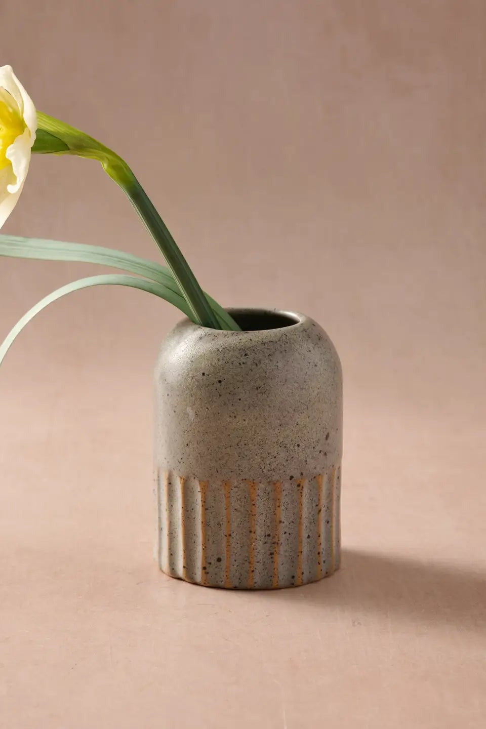 Sundara Fluted Ceramic Vase with a flower coming from inside ©Ten Thousand Villages