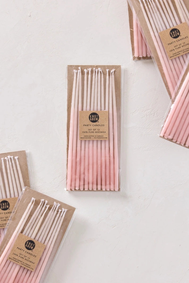 Knot & Bow Tall Ombre Pink beeswax candles multiple packs laying flat