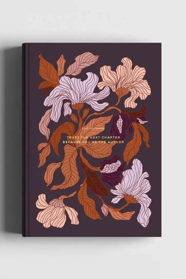 The Floral Peach Blossom Notebook shown from the front with its autumn colored leaves and flowers on black.