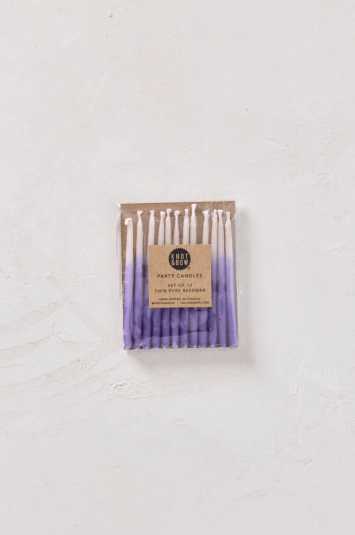 Knot & Bow Short Ombre Violet beeswax candles in its packaging on a white backdrop