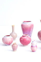 Pink Miniature vases on white by SGW Labs.