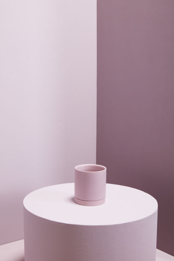 Lilac Romey Pot empty and sitting on a light pink table with pink lilac walls