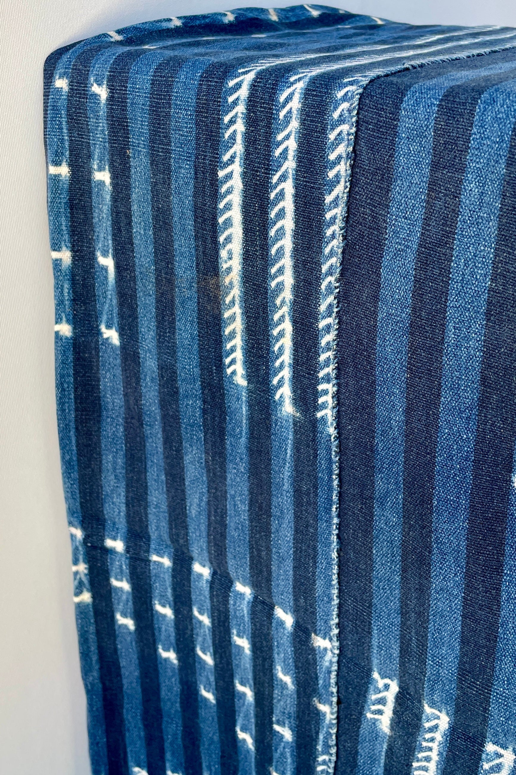 Indigo Tie-Dye mud cloth at Sprout Home shown from the side with its stripes. ©Sprout Home