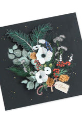 The Winter foliage pop up card open with the floral and greens 3d on black.