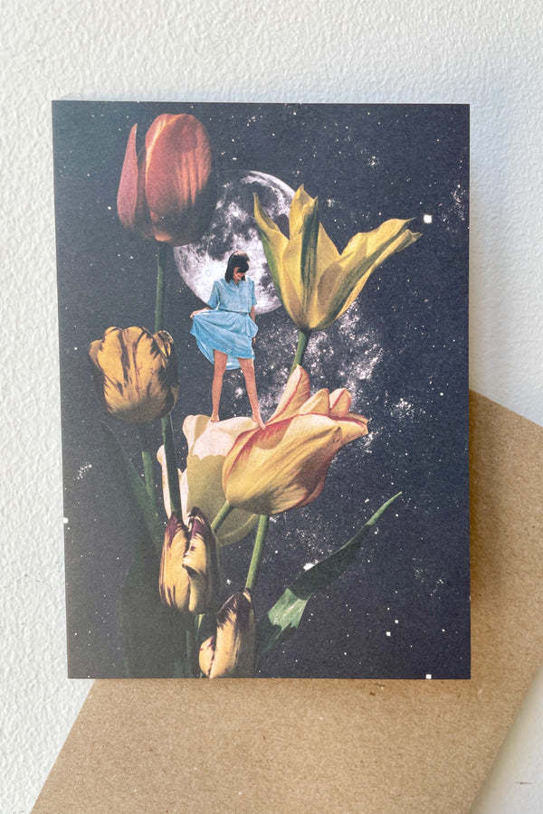 The Garden of Eden Card shown from the front with a Kraft envelope inside.