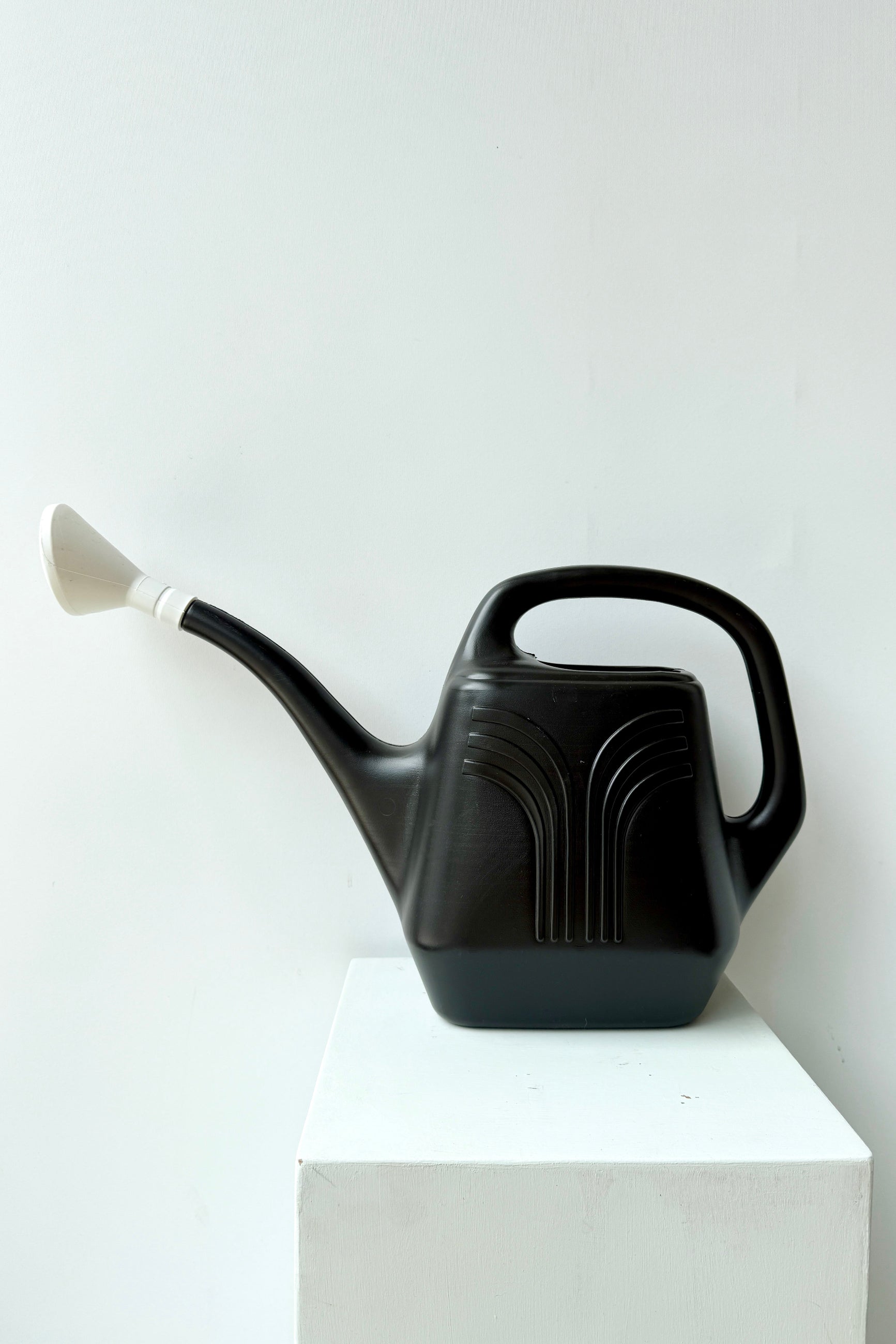 Promo black 2 gallon watering can shown from the side ©Sprout Home