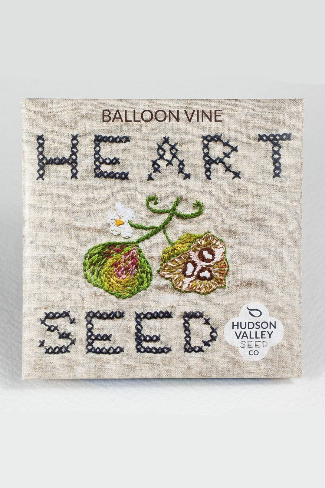 Embroidered seed packet with 'Balloon Vine Heart Seed' text and Hudson Valley Seed Co logo. ©Hudson Valley Seed Co.