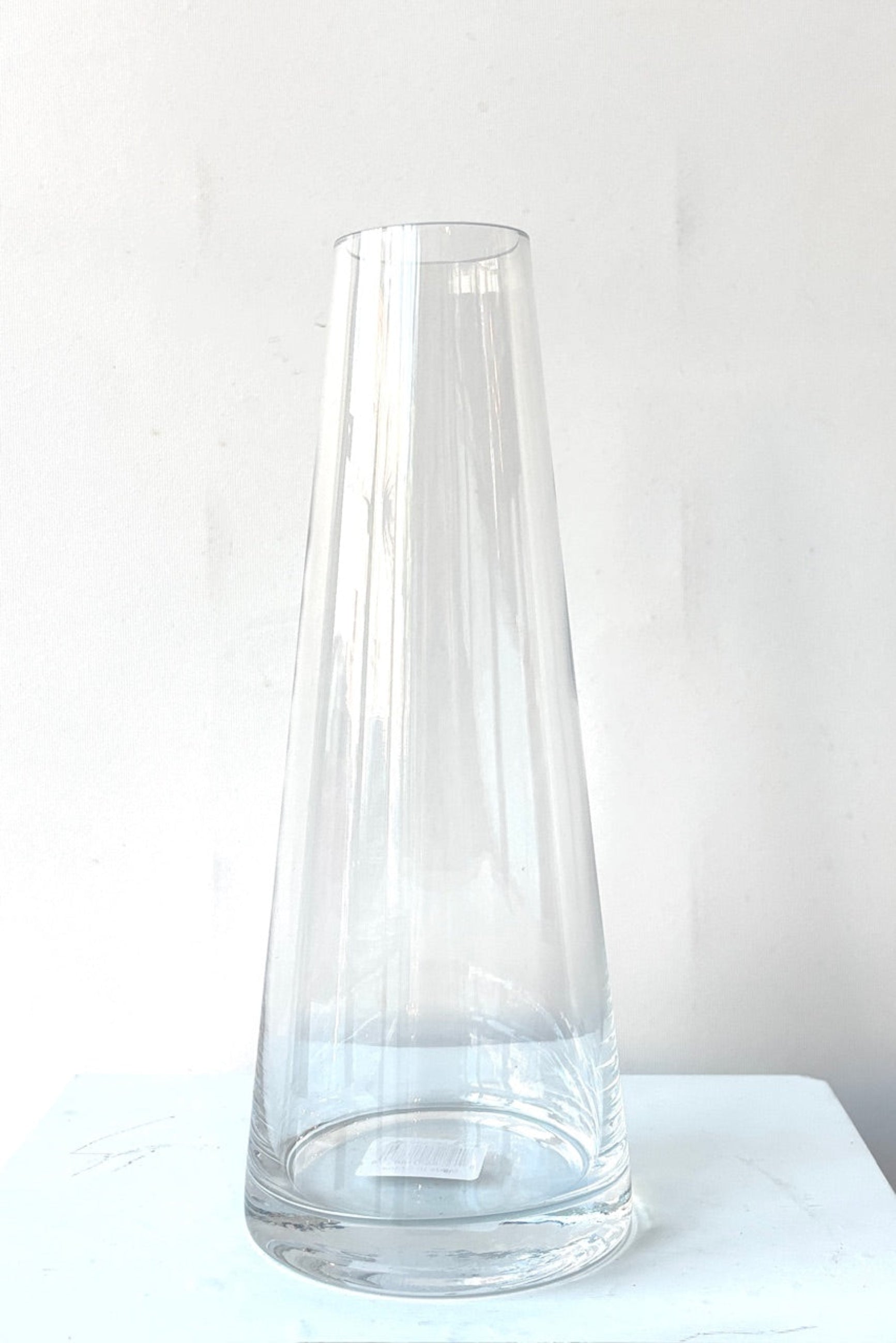 Clear glass Beckon vase against a white background ©Sprout Home