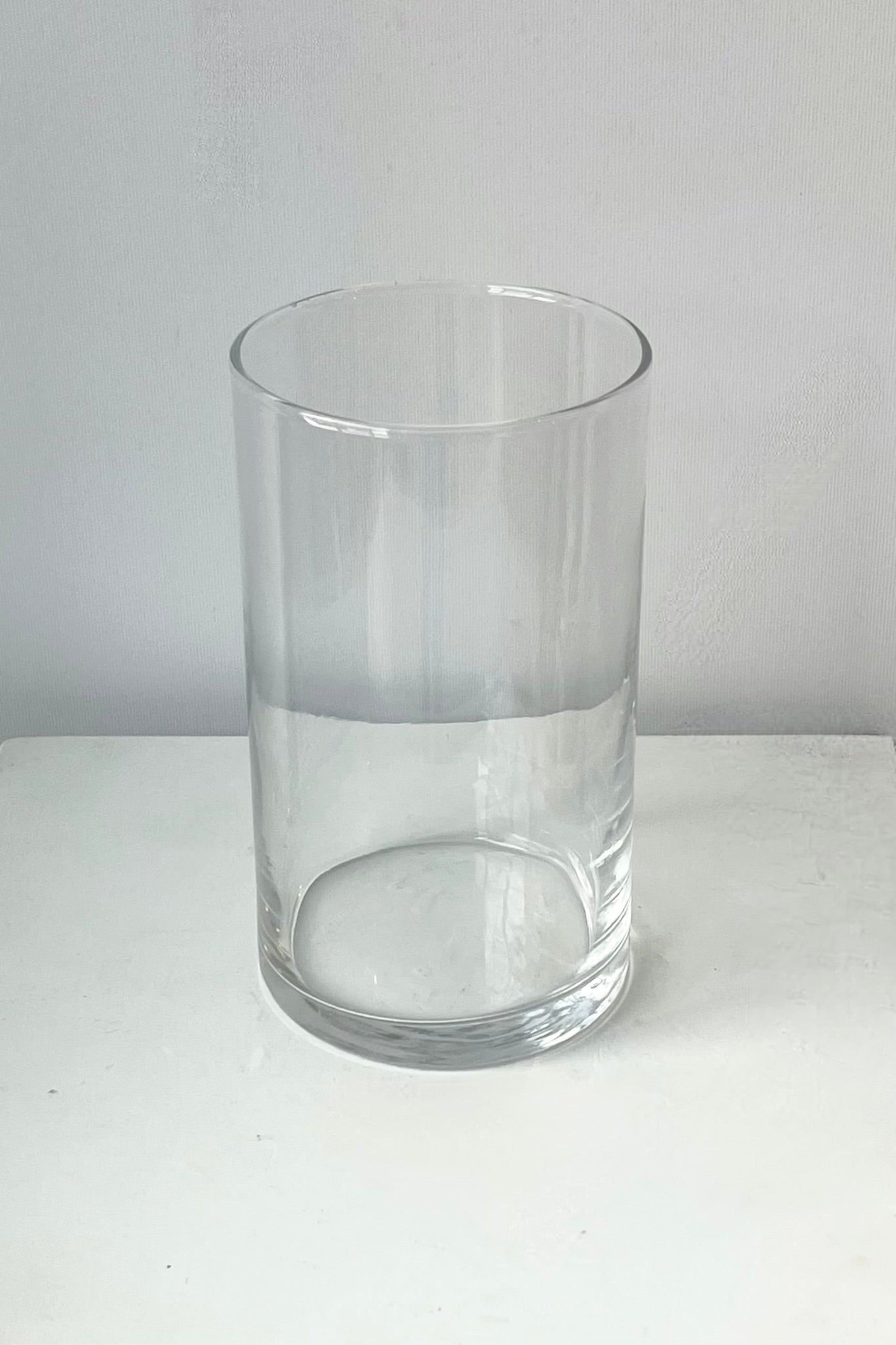 Top view of clear glass vase on a white surface with a light gray background  ©Sprout Home