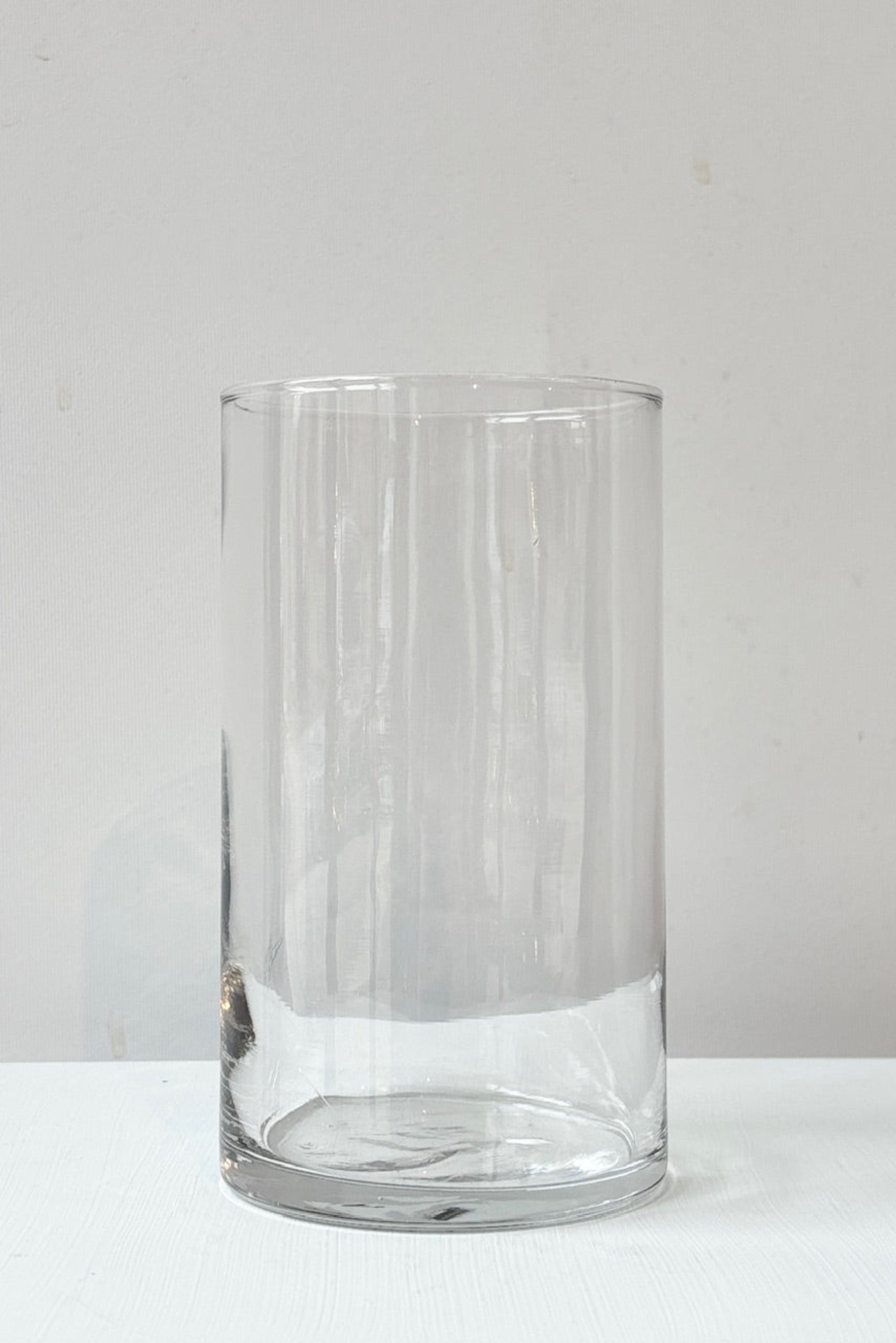 All Purpose Clear Glass Cylinder 3.5" x 6" vase on a white surface with a light gray background ©Sprout Home