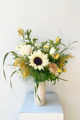 Champagne Toast arrangement by Sprout Home in September featuring a sunflower with a small Jacqueline vase.