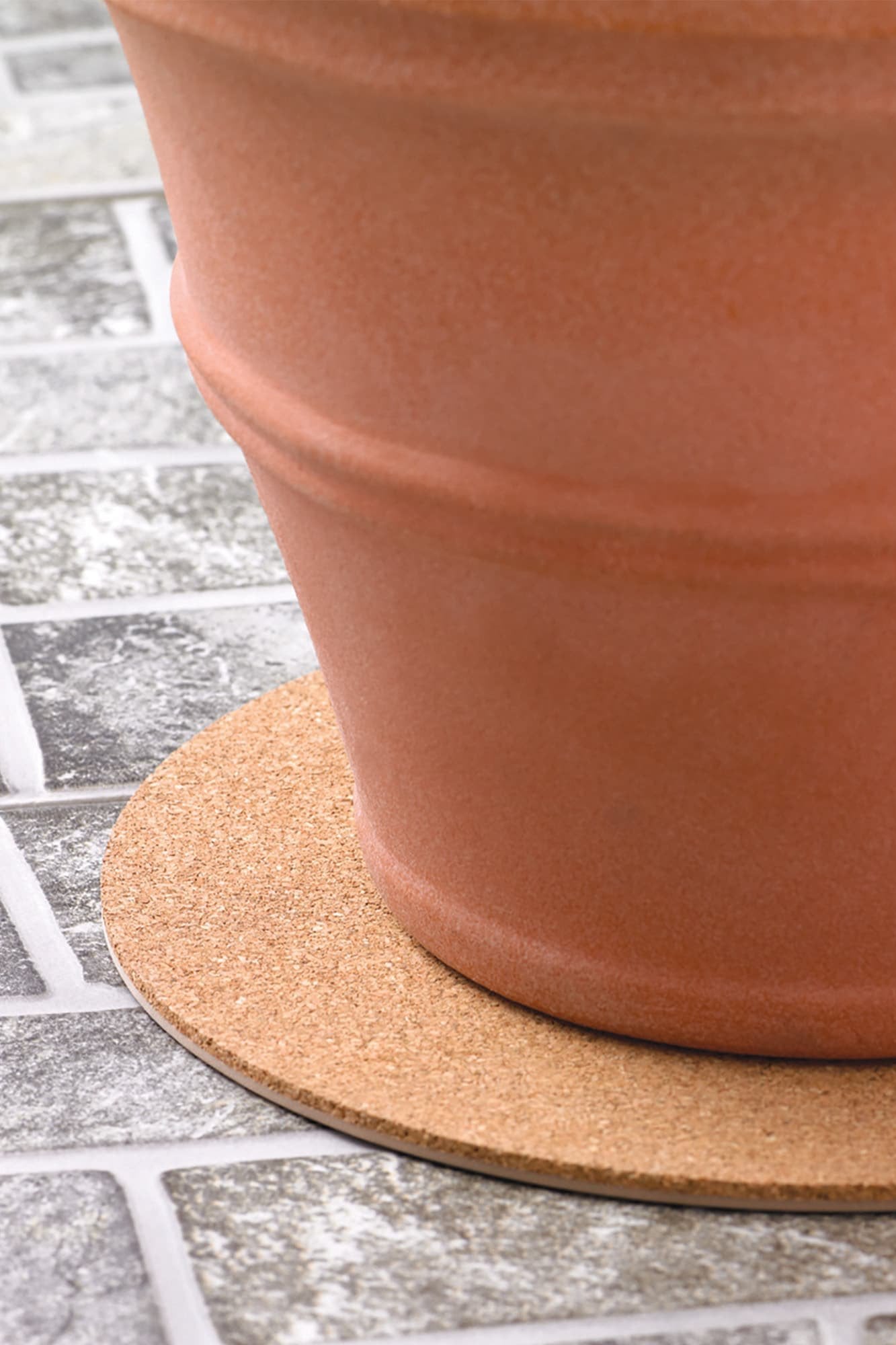 A cork mat under a terracotta pot example close up by Crescent.