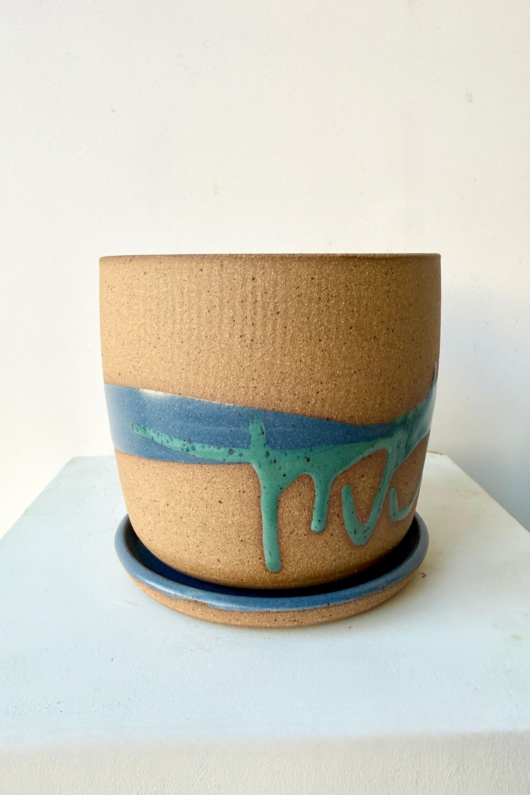 Christina Kosinski Cylinder Pot & Saucer Denim and Dark Teal Splash Glaze 4.5" on a white background ©Sprout Home