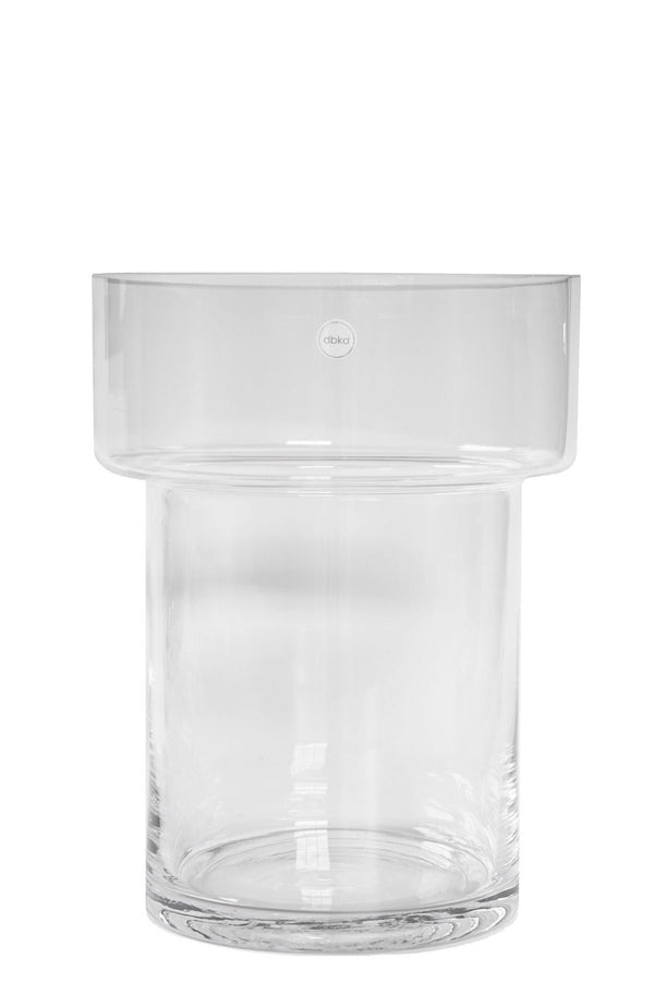 Clear glass Keeper vase empty and against a white backdrop shown from the side.