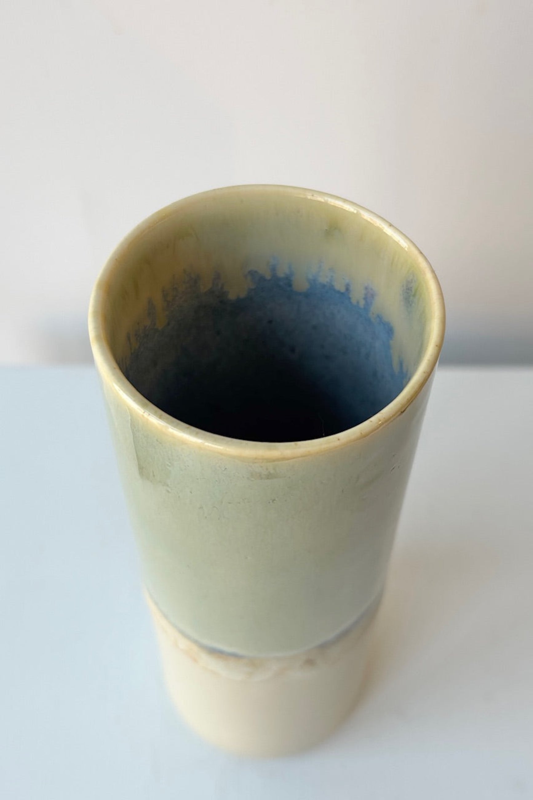 Ceramic vase with blue interior on a white background ©Sprout Home