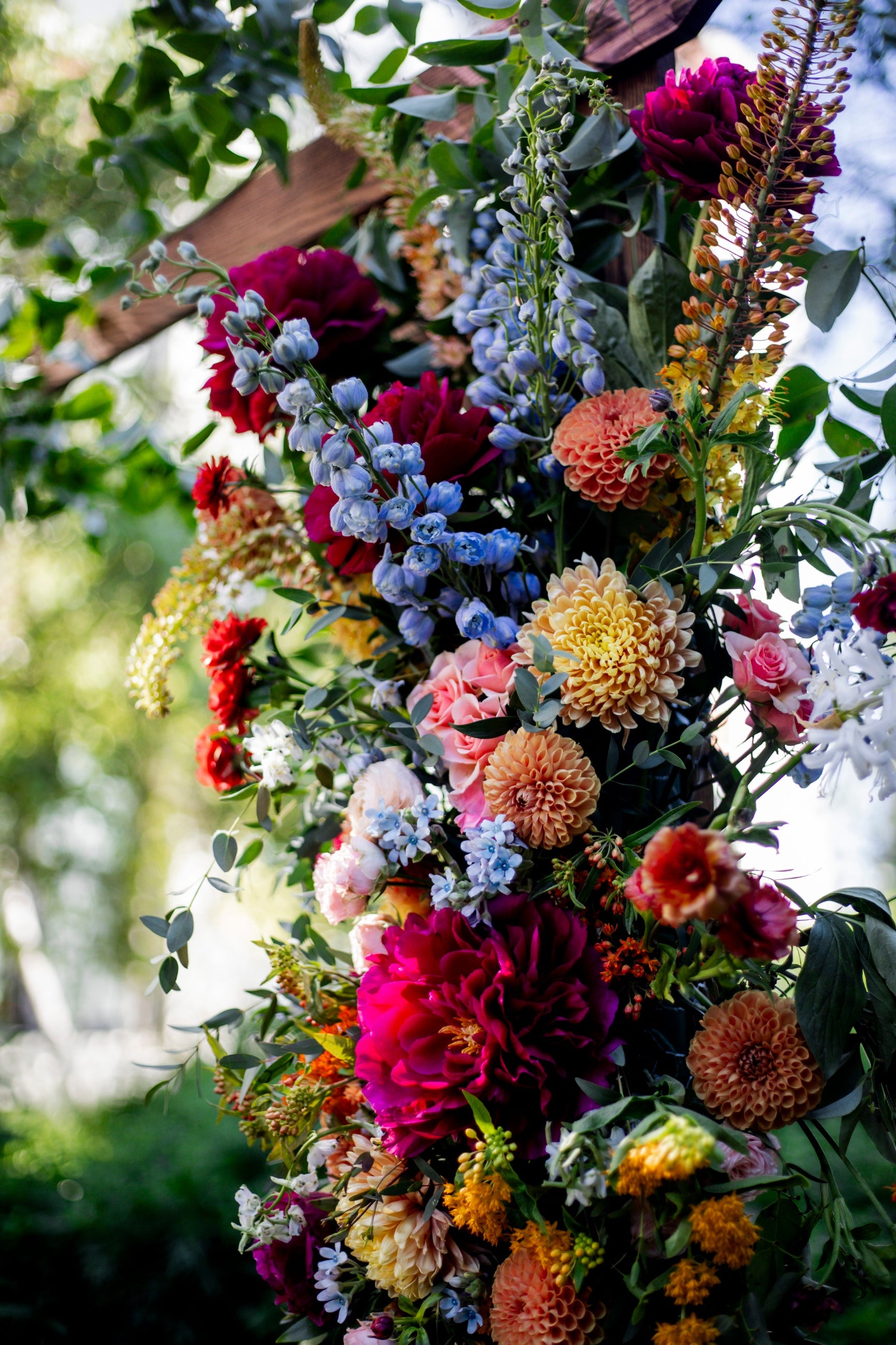 Colorful floral arrangement with a blurred natural background at the Green house Lofts floral by Sprout Home @laynedixonphoto