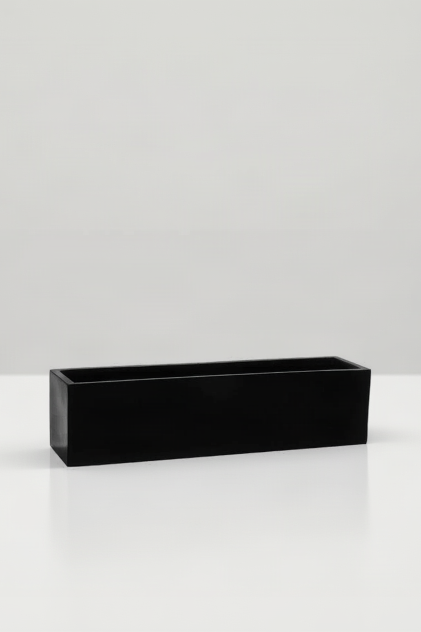 A black rectangular plant on a white background ©Pottery Pots