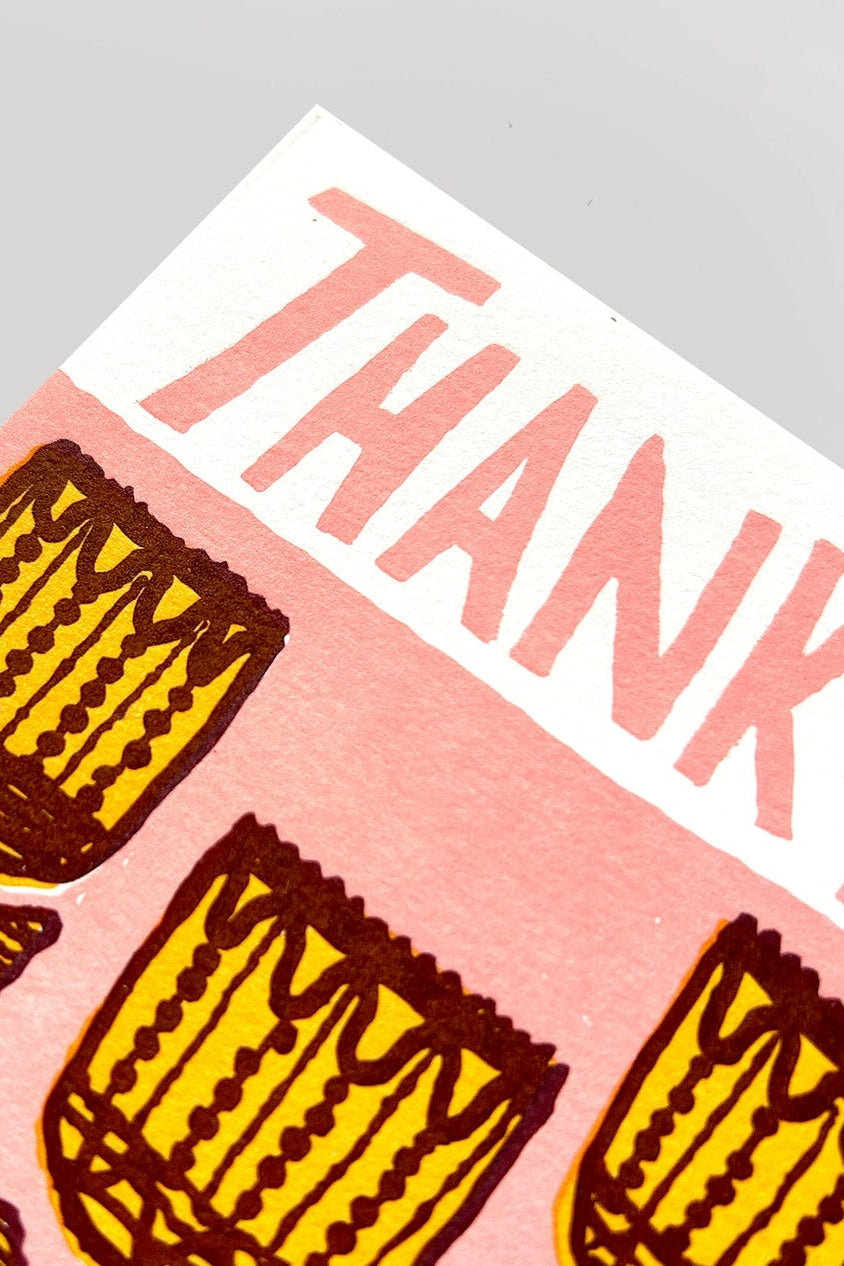 A close photo of the text and graphics on a greeting card with pink and yellow images ©Hammerpress