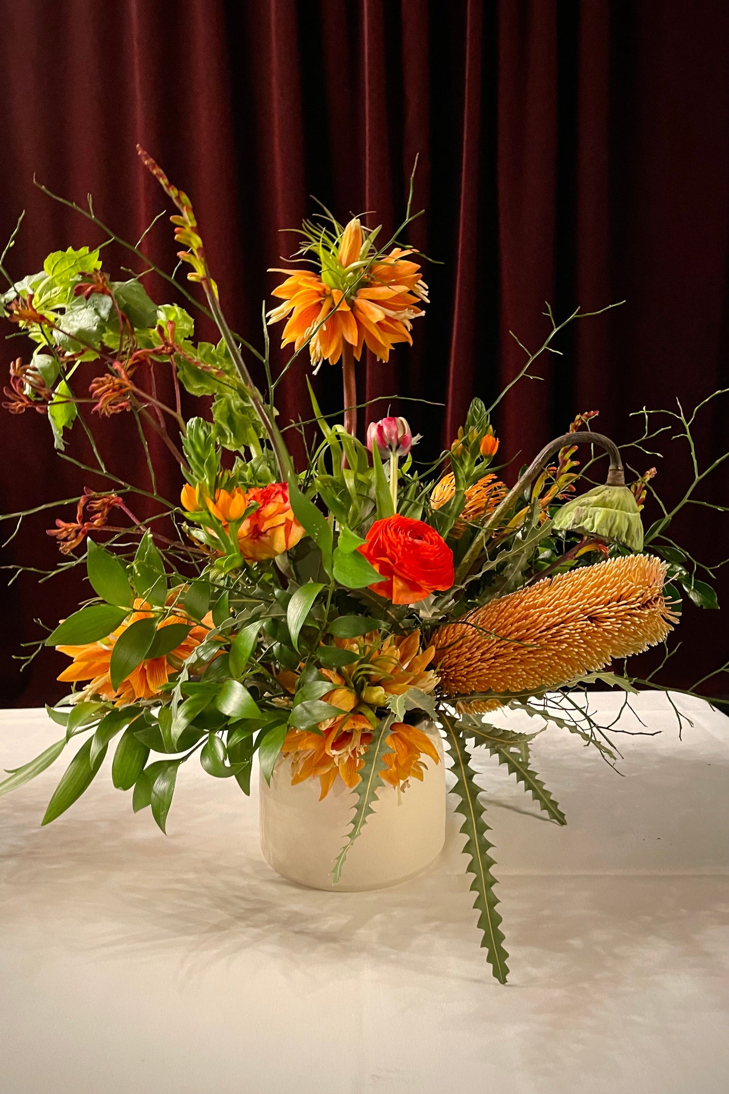 An Earth colored arrangement with tropical and sculptural elements. Floral by SPROUT HOME. Photo by Sprout Home