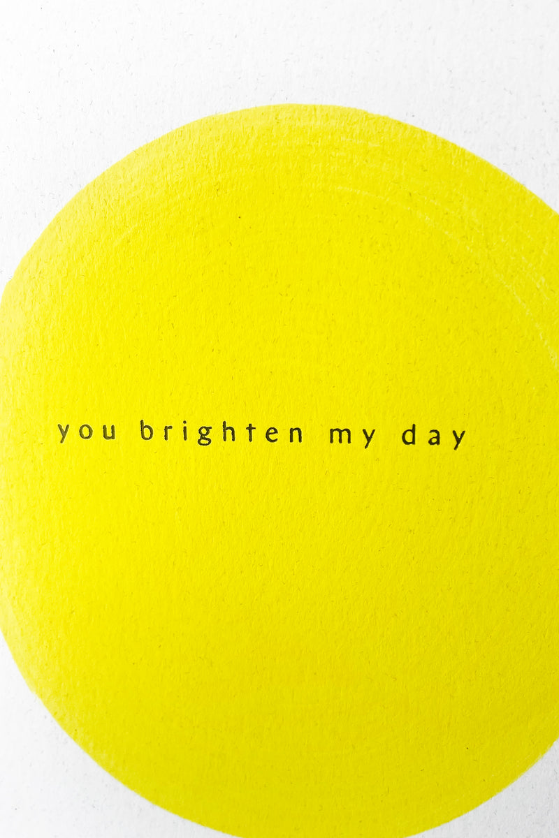 A detailed view of the design on the front of Brighten My Day card
