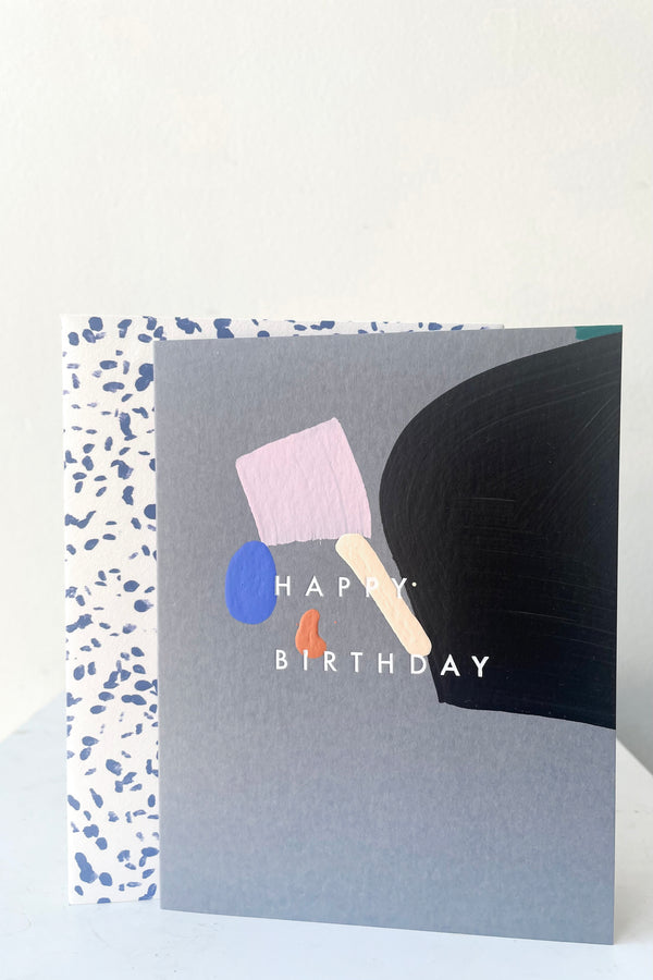 A full frontal view of Carlton Birthday Card with envelope against white backdrop