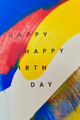 An up close image of the painting and lettering on the Primary Birthday card by Moglea. 