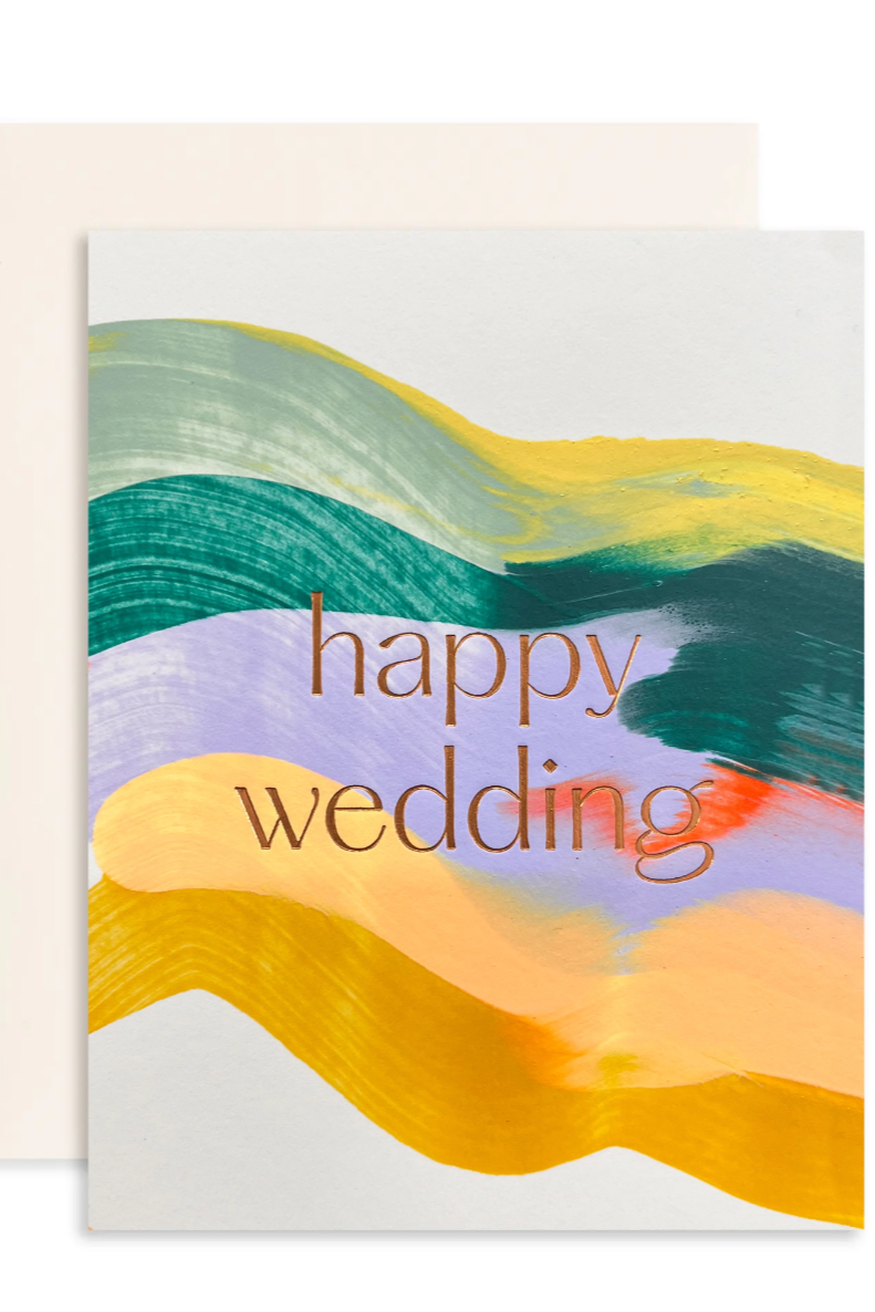 A colorful pattern of pastel brushstrokes with an embossed "Happy Wedding" message in the form of a greeting card shown on a white background ©Sprout Home
