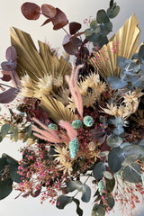 A detail of the 'Faerie' arrangement custom created by Sprout Home showing the mix of neutral and pastel floral components. 