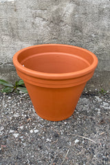 A standard 12" standard clay red pot shown from above and side. 