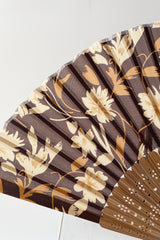 Detail of the silk brown flowers and bamboo on the silk fan at Sprout Home. 