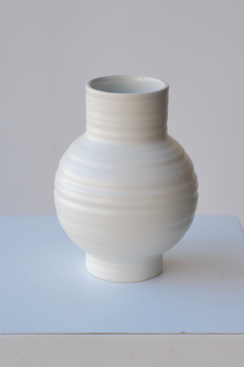 Essential Bone vase in Small by Hawkins looking from the side top against white. 