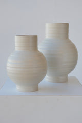 Pair of Essential Hawkins Light grey vases against white.