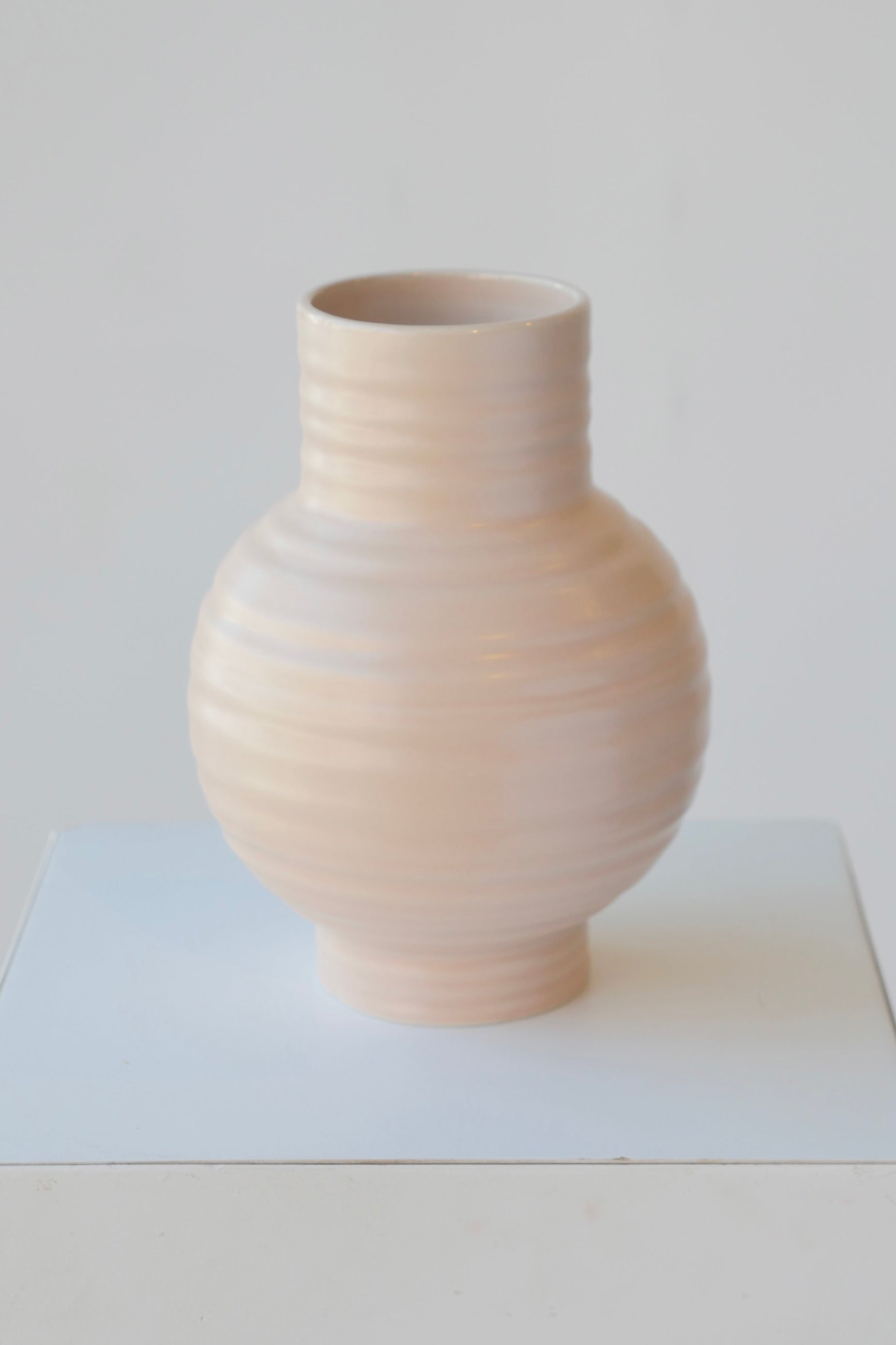 Large essential vase in Blush color by Hawkins New York against white.  ©Sprout Home