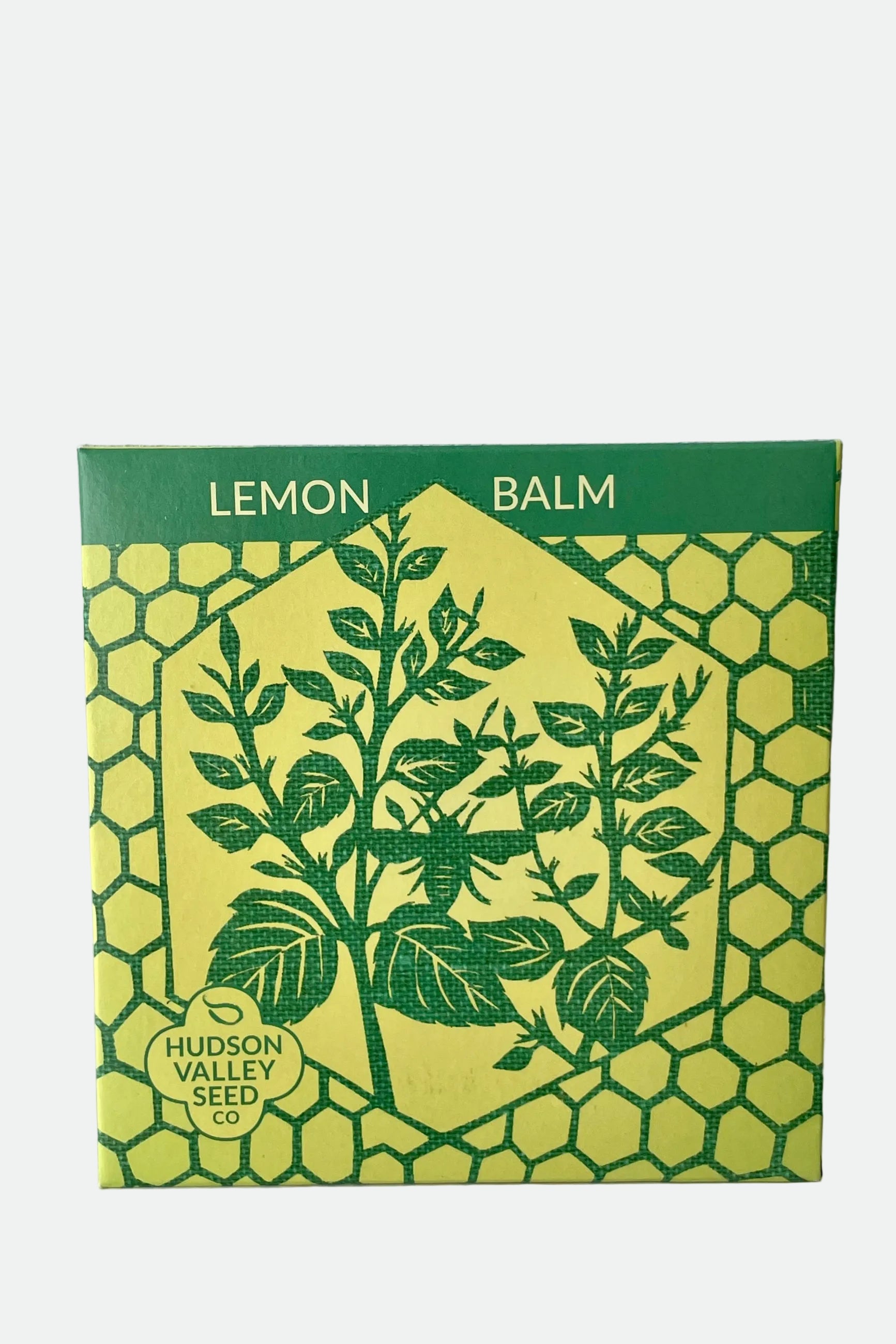 Packaging for Lemon Balm seeds featuring an illustration of the plant on a green and yellow background with text. ©Sprout Home