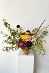 A harvest earth arrangement created by Sprout Home in a terracotta compote