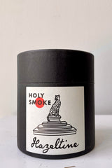 Hazeltine Holy Smoke candle packaging from the front.