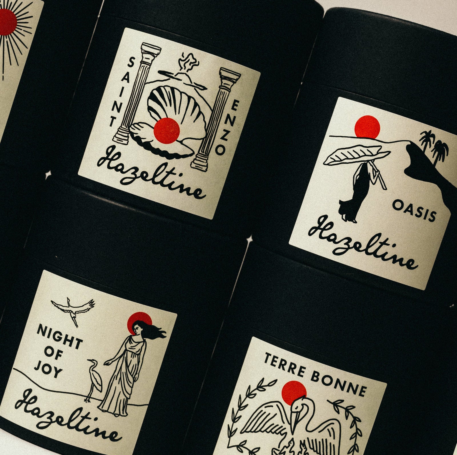 Collection of black containers with Hazeltonie labels on a white background ©Hazeltine