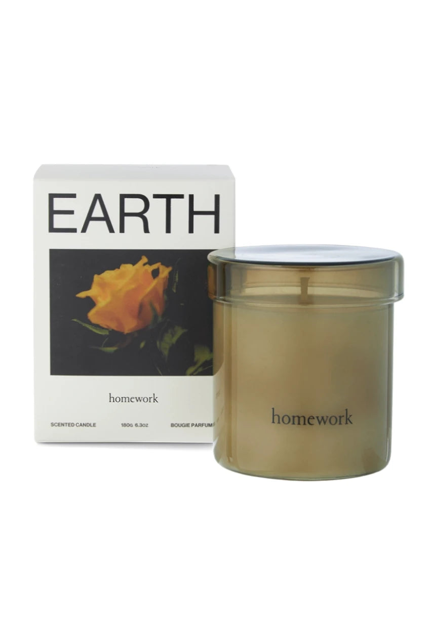 Earth candle showing its packaging and candle separate by Homework. 