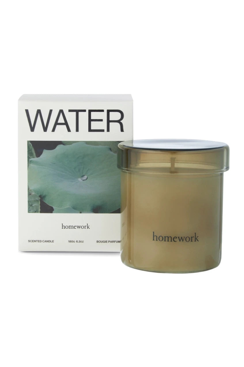 Water candle showing the packaging and also the glass filled candle by Homework. 